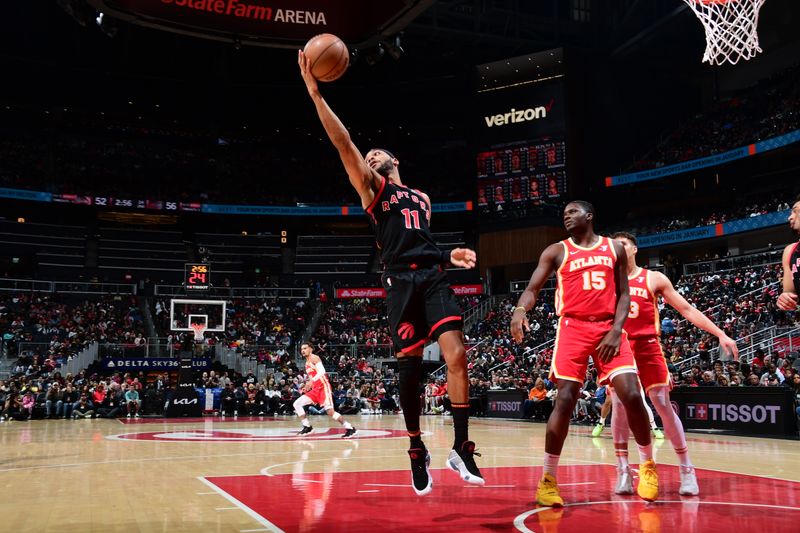 ATLANTA, GA - JANUARY 28: Bruce Brown #11 of the Toronto Raptors grabs the rebound during the game against the Atlanta Hawks on January 28, 2024 at State Farm Arena in Atlanta, Georgia.  NOTE TO USER: User expressly acknowledges and agrees that, by downloading and/or using this Photograph, user is consenting to the terms and conditions of the Getty Images License Agreement. Mandatory Copyright Notice: Copyright 2024 NBAE (Photo by Scott Cunningham/NBAE via Getty Images)