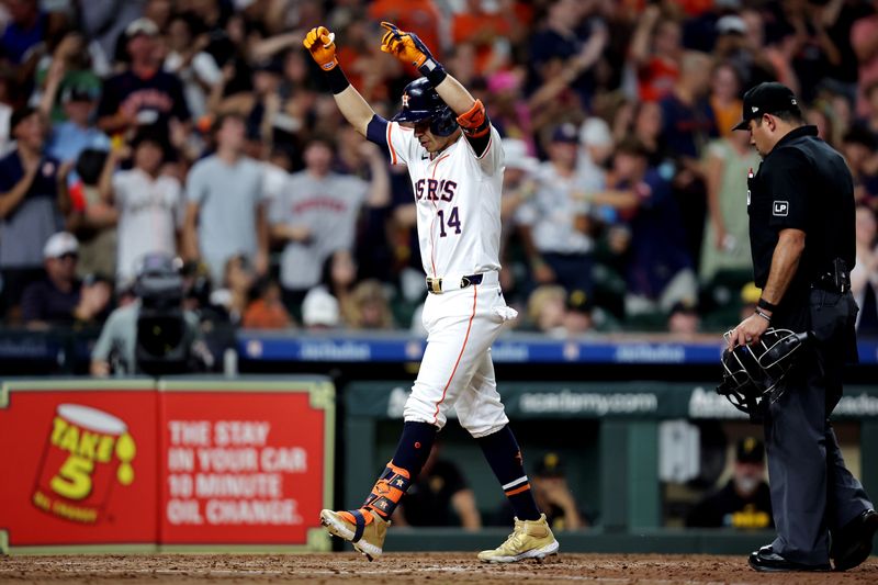 Jul 31, 2024; Houston, Texas, USA; Houston Astros pinch hitter Mauricio Dubón (14) reacts after hitting a two-run home run against the Pittsburgh Pirates during the sixth inning at Minute Maid Park. Mandatory Credit: Erik Williams-USA TODAY Sports