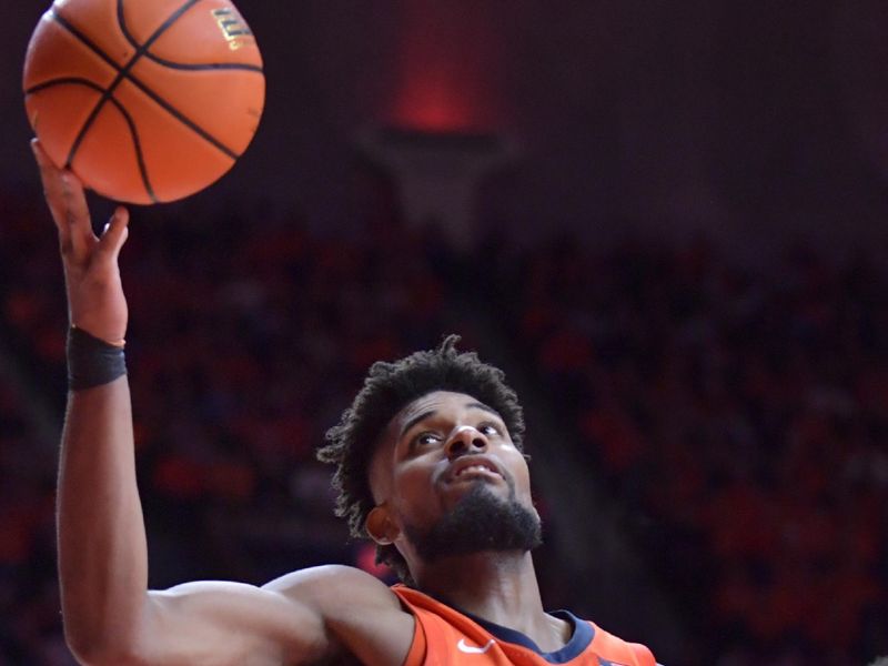 Jan 11, 2024; Champaign, Illinois, USA;  Illinois Fighting Illini forward Quincy Guerrier (13) grabs a rebound during the second half against the Michigan State Spartans at State Farm Center. Mandatory Credit: Ron Johnson-USA TODAY Sports