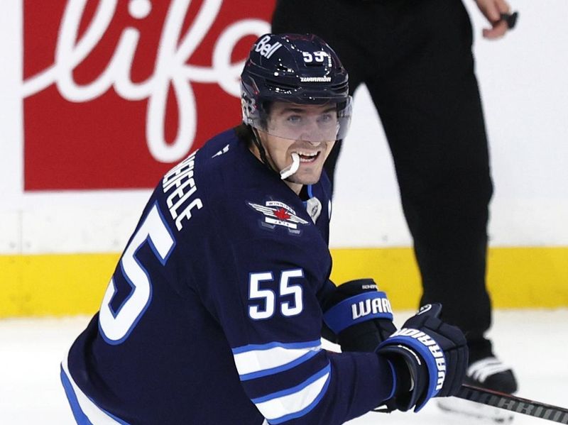Oct 11, 2025; Winnipeg, Manitoba, CAN; Winnipeg Jets center Mark Scheifele (55) celebrates his goal against the Los Angeles Kings in the third period at Canada Life Centre. Mandatory Credit: James Carey Lauder-Imagn Images