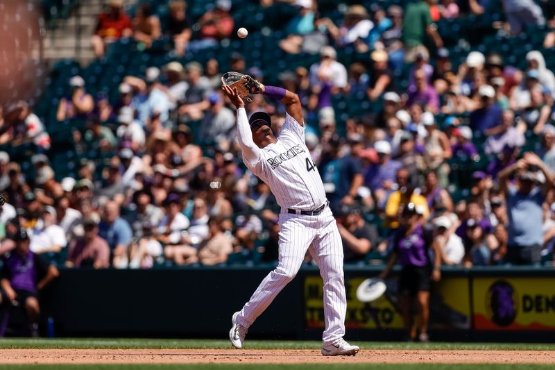 Aug 20, 2023; Denver, Colorado, USA; Colorado Rockies first baseman Elehuris Montero (44) makes a catch in the third inning against the Chicago White Sox at Coors Field. Mandatory Credit: Isaiah J. Downing-USA TODAY Sports