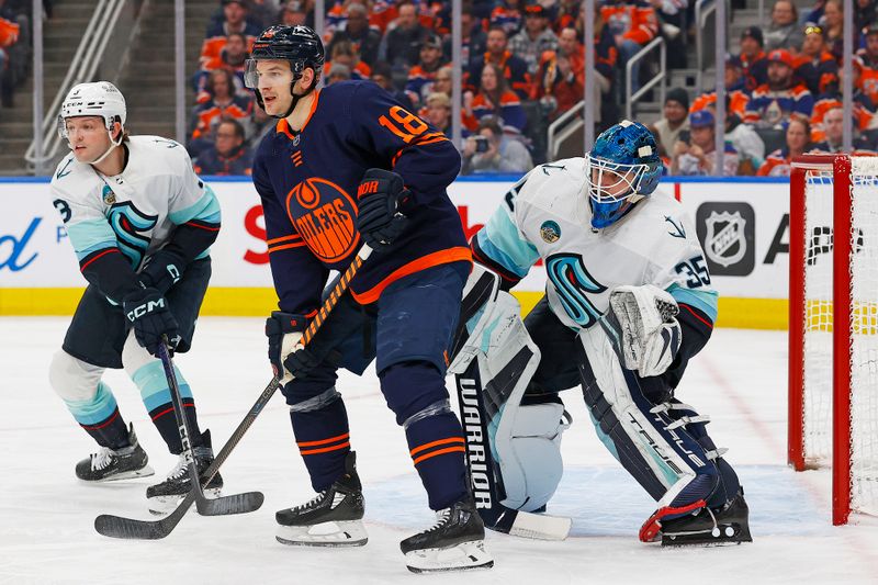 Jan 18, 2024; Edmonton, Alberta, CAN; Edmonton Oilers forward Zach Hyman (18) tries to screen Seattle Kraken goaltender Joey Daccord (35) during the first period at Rogers Place. Mandatory Credit: Perry Nelson-USA TODAY Sports