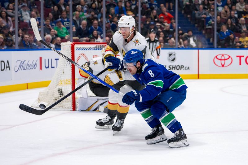 Apr 8, 2024; Vancouver, British Columbia, CAN; Vancouver Canucks forward Conor Garland (8) and Vegas Golden Knights defenseman Noah Hanifin (15) battle for the puck in the third period at Rogers Arena. Canucks won 4 -3. Mandatory Credit: Bob Frid-USA TODAY Sports