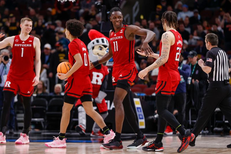 Mar 9, 2023; Chicago, IL, USA; Rutgers Scarlet Knights players celebrate after defeating the Michigan Wolverines at United Center. Mandatory Credit: Kamil Krzaczynski-USA TODAY Sports