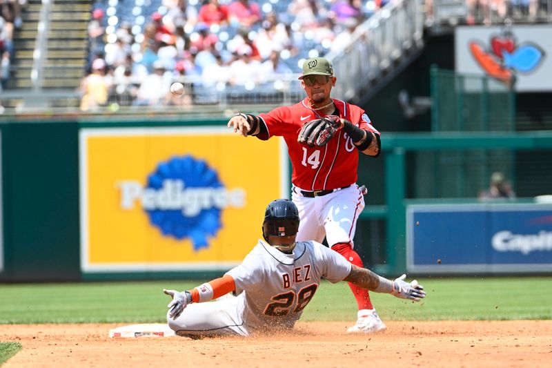 May 21, 2023; Washington, District of Columbia, USA; Washington Nationals shortstop Ildemaro Vargas (14) completes a double play over Detroit Tigers shortstop Javier Baez (28) during the second inning at Nationals Park. Mandatory Credit: Brad Mills-USA TODAY Sports