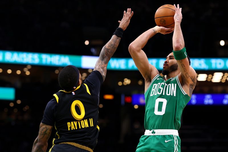 BOSTON, MASSACHUSETTS - MARCH 03: Jayson Tatum #0 of the Boston Celtics takes a shot against Gary Payton II #0 of the Golden State Warriors during the first quarter at TD Garden on March 03, 2024 in Boston, Massachusetts. NOTE TO USER: User expressly acknowledges and agrees that, by downloading and or using this photograph, user is consenting to the terms and conditions of the Getty Images License Agreement.  (Photo by Maddie Meyer/Getty Images)