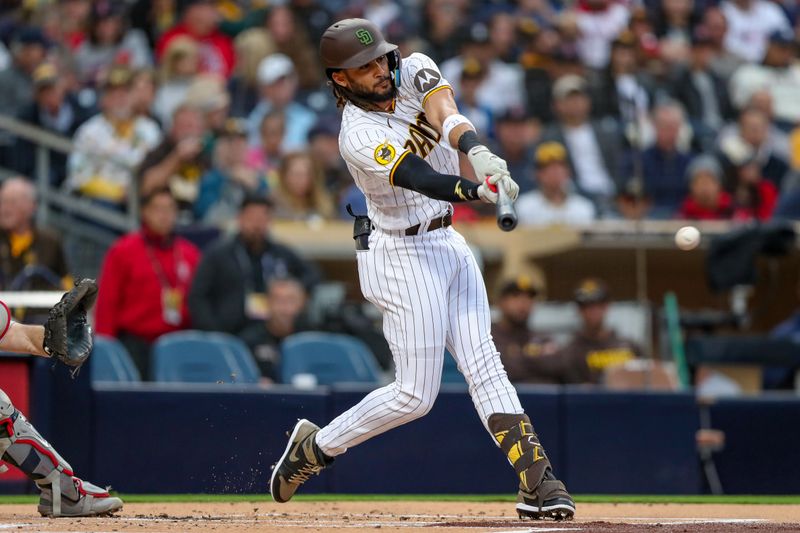 May 19, 2023; San Diego, California, USA;  San Diego Padres right fielder Fernando Tatis Jr. (23) hits a single in the first inning against the Boston Red Sox at Petco Park. Mandatory Credit: David Frerker-USA TODAY Sports