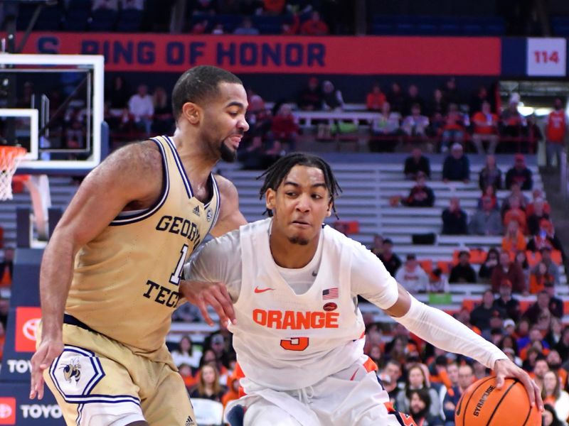 Feb 28, 2023; Syracuse, New York, USA; Syracuse Orange guard Judah Mintz (3) tries to drive the ball past Georgia Tech Yellow Jackets guard Kyle Sturdivant (1) in the second half at the JMA Wireless Dome. Mandatory Credit: Mark Konezny-USA TODAY Sports