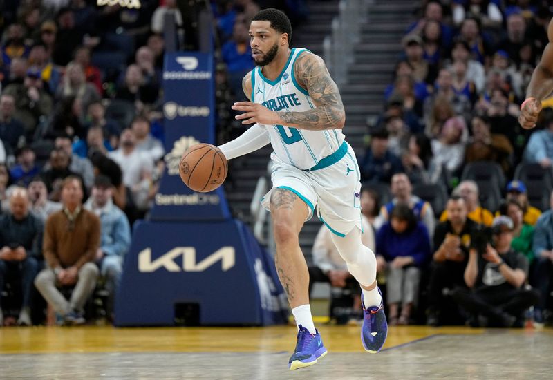 SAN FRANCISCO, CALIFORNIA - FEBRUARY 23: Miles Bridges #0 of the Charlotte Hornets dribbles the ball up court against the Golden State Warriors during the fourth quarter of an NBA basketball game at Chase Center on February 23, 2024 in San Francisco, California. NOTE TO USER: User expressly acknowledges and agrees that, by downloading and or using this photograph, User is consenting to the terms and conditions of the Getty Images License Agreement. (Photo by Thearon W. Henderson/Getty Images)