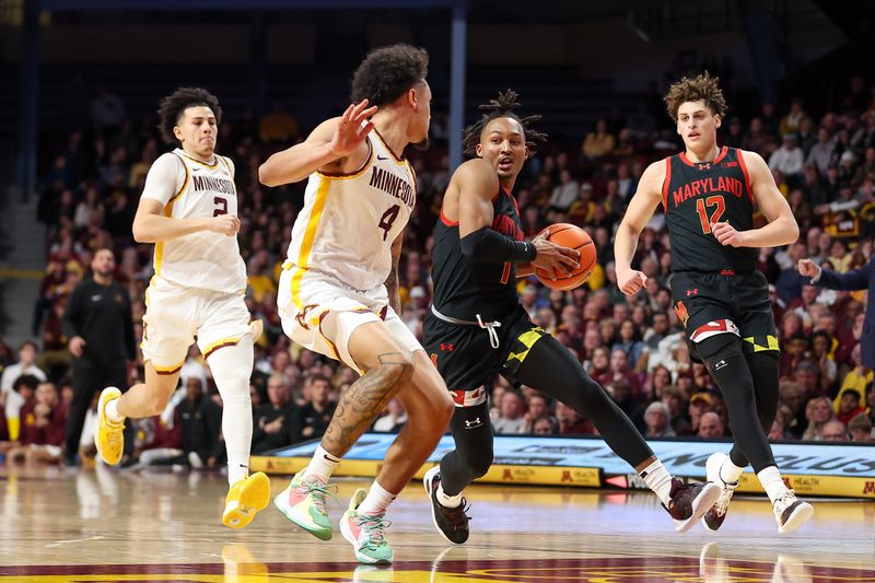 Jan 7, 2024; Minneapolis, Minnesota, USA; Maryland Terrapins guard Jahmir Young (1) works towards the basket as Minnesota Golden Gophers guard Braeden Carrington (4) defends during the second half at Williams Arena. Mandatory Credit: Matt Krohn-USA TODAY Sports