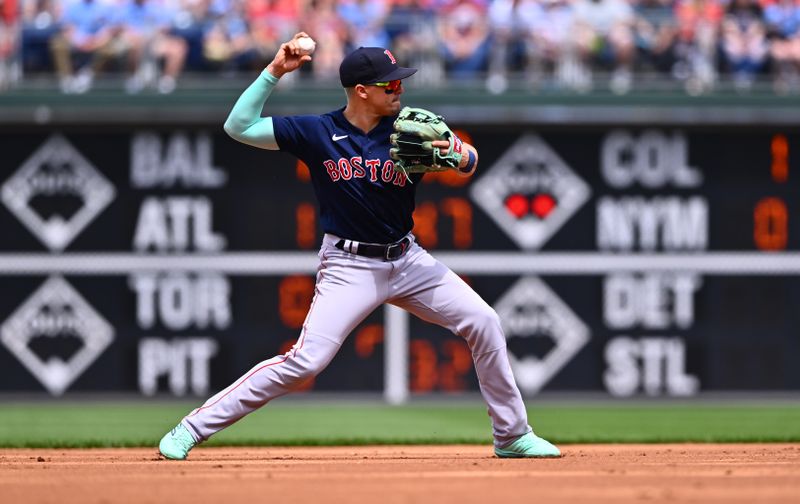 May 7, 2023; Philadelphia, Pennsylvania, USA; Boston Red Sox shortstop Kike Hernandez (5) throws to first against the Philadelphia Phillies in the first inning at Citizens Bank Park. Mandatory Credit: Kyle Ross-USA TODAY Sports