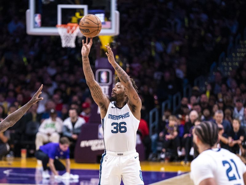 LOS ANGELES, CA - JANUARY 5: Marcus Smart #36 of the Memphis Grizzlies shoots a three point basket against the Los Angeles Lakers on January 5, 2024 at Crypto.Com Arena in Los Angeles, California. NOTE TO USER: User expressly acknowledges and agrees that, by downloading and/or using this Photograph, user is consenting to the terms and conditions of the Getty Images License Agreement. Mandatory Copyright Notice: Copyright 2024 NBAE (Photo by Tyler Ross/NBAE via Getty Images)