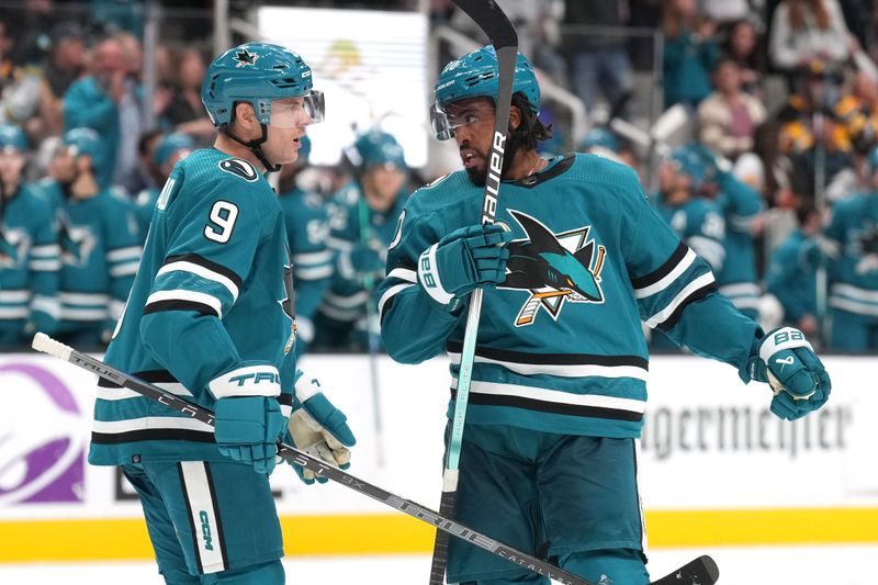 Nov 4, 2023; San Jose, California, USA; San Jose Sharks left wing Anthony Duclair (right) celebrates with defenseman Jacob MacDonald (9) after scoring a goal against the Pittsburgh Penguins during the second period at SAP Center at San Jose. Mandatory Credit: Darren Yamashita-USA TODAY Sports