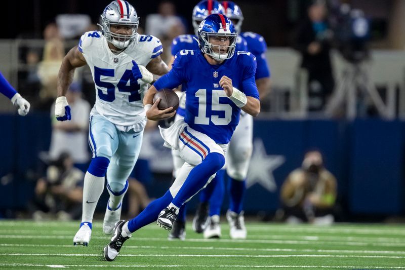 New York Giants quarterback Tommy DeVito (15) carries the ball during the second half of an NFL football game against the Dallas Cowboys, Sunday, Nov. 12, 2023, in Arlington, Texas. Dallas won 49-17. (AP Photo/Brandon Wade)