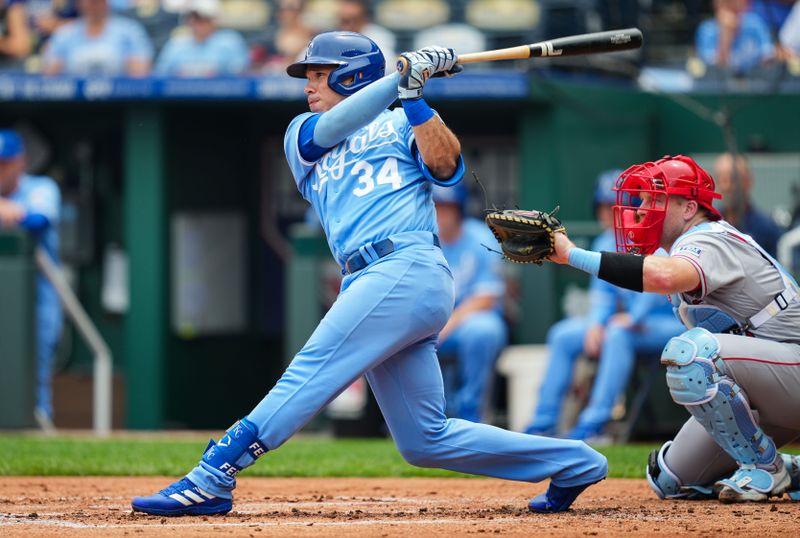 Jun 18, 2023; Kansas City, Missouri, USA; Kansas City Royals catcher Freddy Fermin (34) hits an RBI single during the second inning against the Los Angeles Angels at Kauffman Stadium. Mandatory Credit: Jay Biggerstaff-USA TODAY Sports