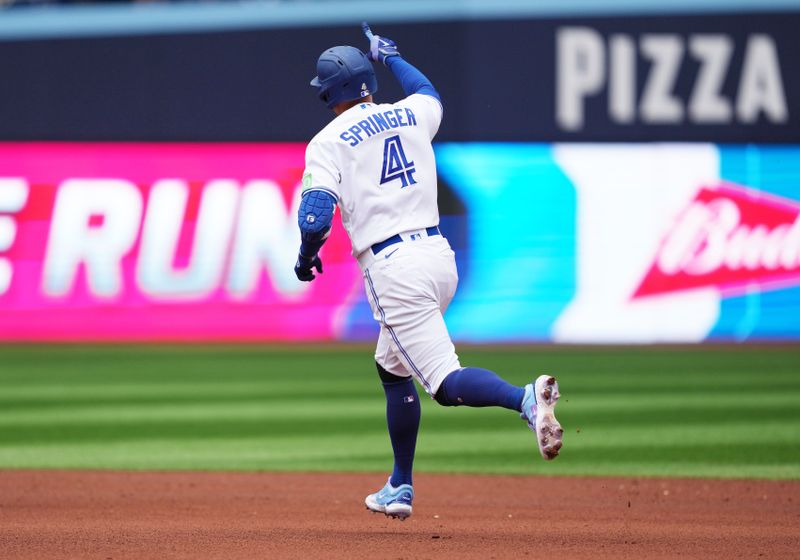 Sep 9, 2023; Toronto, Ontario, CAN; Toronto Blue Jays right fielder George Springer (4) celebrates hitting a home run against the Kansas City Royals during the fourth inning at Rogers Centre. Mandatory Credit: Nick Turchiaro-USA TODAY Sports