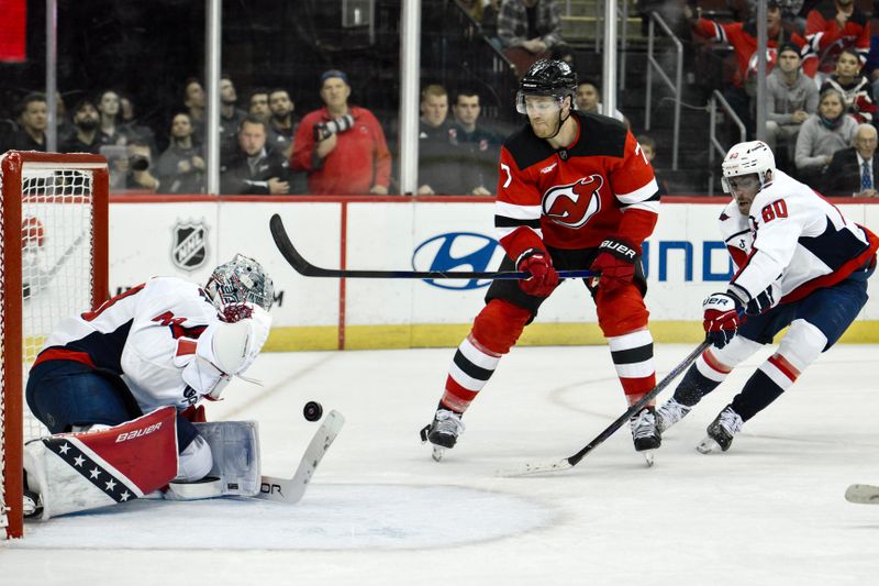 Oct 19, 2024; Newark, New Jersey, USA; Washington Capitals goaltender Logan Thompson (48) makes a save against New Jersey Devils defenseman Dougie Hamilton (7) during the overtime period at Prudential Center. Mandatory Credit: John Jones-Imagn Images