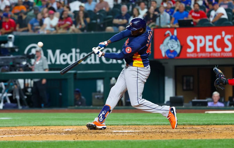 Aug 6, 2024; Arlington, Texas, USA; Houston Astros left fielder Yordan Alvarez (44) hits a two-run home run during the ninth inning against the Texas Rangers at Globe Life Field. Mandatory Credit: Kevin Jairaj-USA TODAY Sports