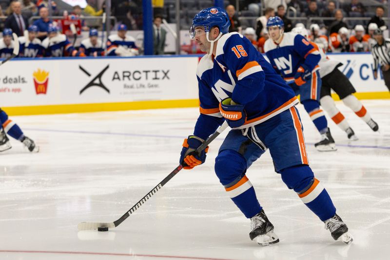 Nov 25, 2023; Elmont, New York, USA; New York Islanders right wing Cal Clutterbuck (15) skates with the puck against the Philadelphia Flyers during the second period at UBS Arena. Mandatory Credit: Thomas Salus-USA TODAY Sports