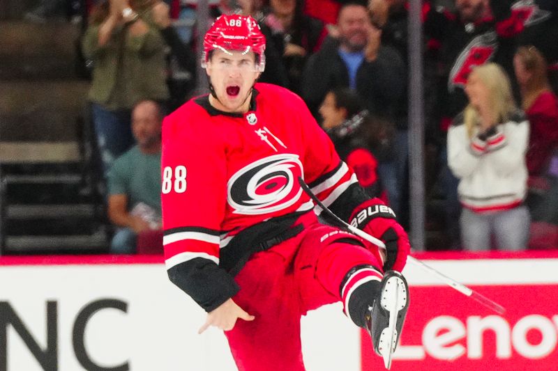 Oct 26, 2023; Raleigh, North Carolina, USA; Carolina Hurricanes center Martin Necas (88) celebrates his game winning goal in the overtime against the Seattle Kraken at PNC Arena. Mandatory Credit: James Guillory-USA TODAY Sports