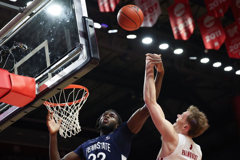 Jan 31, 2024; Piscataway, New Jersey, USA; Penn State Nittany Lions forward Qudus Wahab (22) rebounds against Rutgers Scarlet Knights forward Oskar Palmquist (9)  during the first half at Jersey Mike's Arena. Mandatory Credit: Vincent Carchietta-USA TODAY Sports