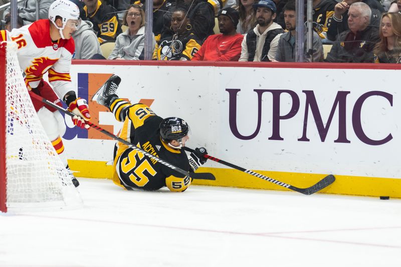 Oct 14, 2023; Pittsburgh, Pennsylvania, USA; Pittsburgh Penguins center Noel Acciari (55) reaches for the puck as Calgary Flames defenseman Nikita Zadorov (16) skates behind him during the first period at PPG Paints Arena. Mandatory Credit: Scott Galvin-USA TODAY Sports