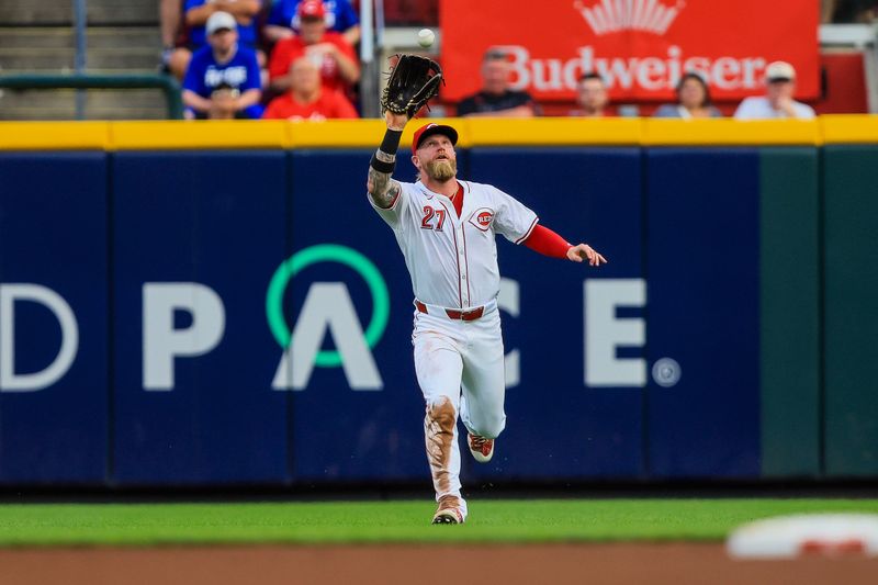 Jul 29, 2024; Cincinnati, Ohio, USA; Cincinnati Reds outfielder Jake Fraley (27) catches a pop up hit by Chicago Cubs designated hitter Mike Tauchman (not pictured) in the fourth inning at Great American Ball Park. Mandatory Credit: Katie Stratman-USA TODAY Sports