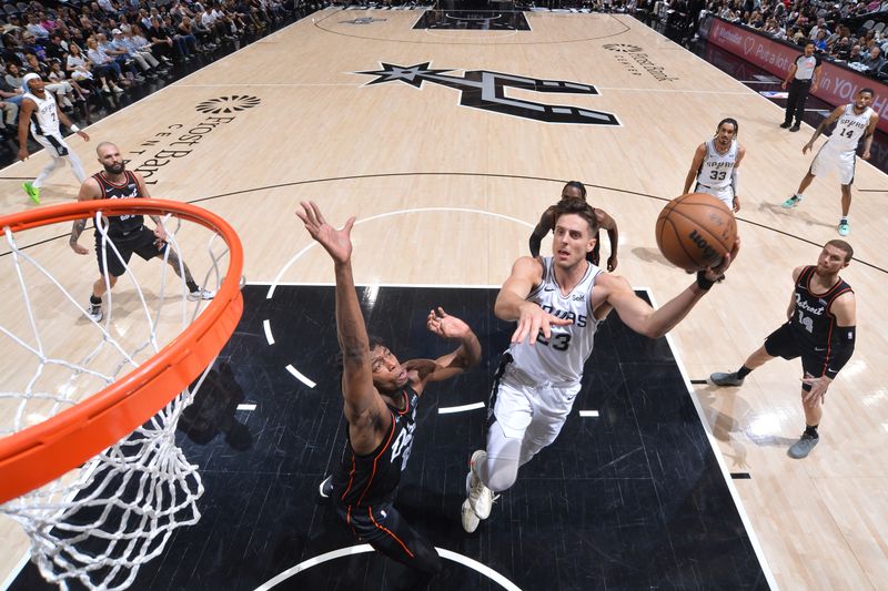 SAN ANTONIO, TX - APRIL 14:  Zach Collins #23 of the San Antonio Spurs drives to the basket during the game against the Detroit Pistons on April 14, 2024 at the Frost Bank Center in San Antonio, Texas. NOTE TO USER: User expressly acknowledges and agrees that, by downloading and or using this photograph, user is consenting to the terms and conditions of the Getty Images License Agreement. Mandatory Copyright Notice: Copyright 2024 NBAE (Photos by Michael Gonzales/NBAE via Getty Images)