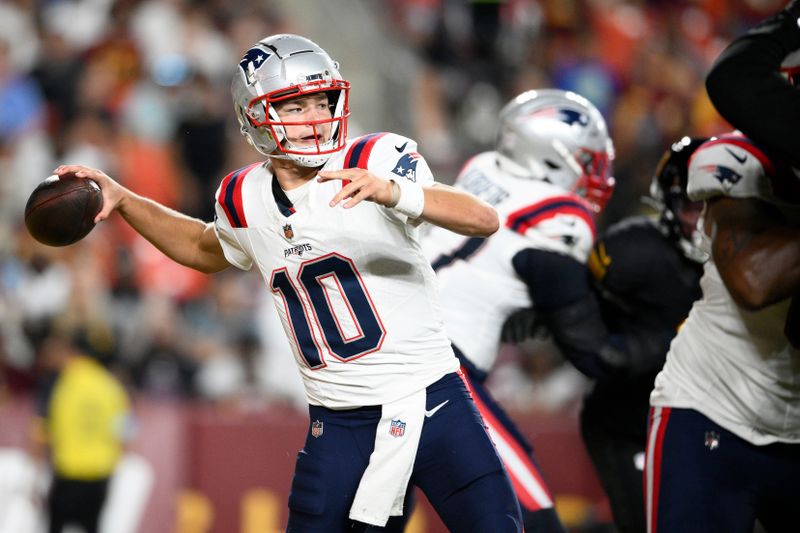 New England Patriots quarterback Drake Maye (10) passes against the Washington Commanders during the first half of a preseason NFL football game, Sunday, Aug. 25, 2024, in Landover, Md. (AP Photo/Nick Wass)