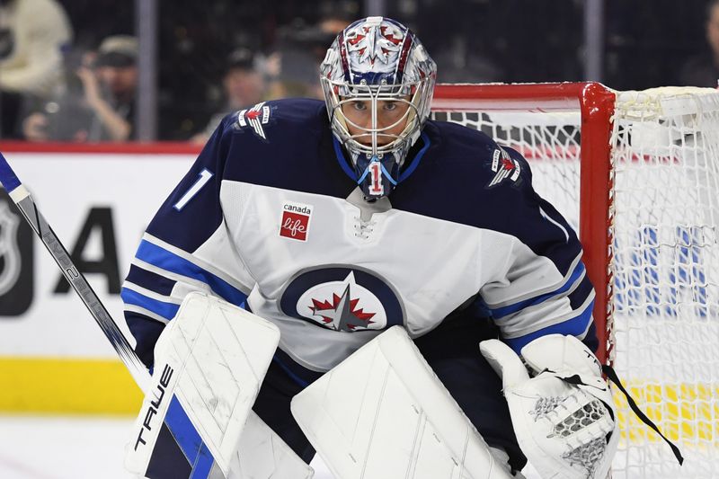 Mar 6, 2025; Philadelphia, Pennsylvania, USA; Winnipeg Jets goaltender Eric Comrie (1) against the Philadelphia Flyers during the third period at Wells Fargo Center. Mandatory Credit: Eric Hartline-Imagn Images