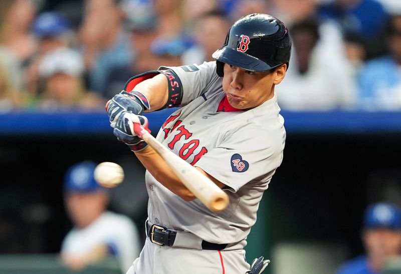 Aug 7, 2024; Kansas City, Missouri, USA; Boston Red Sox designated hitter Masataka Yoshida (7) hits a single during the fourth inning against the Kansas City Royals at Kauffman Stadium. Mandatory Credit: Jay Biggerstaff-USA TODAY Sports