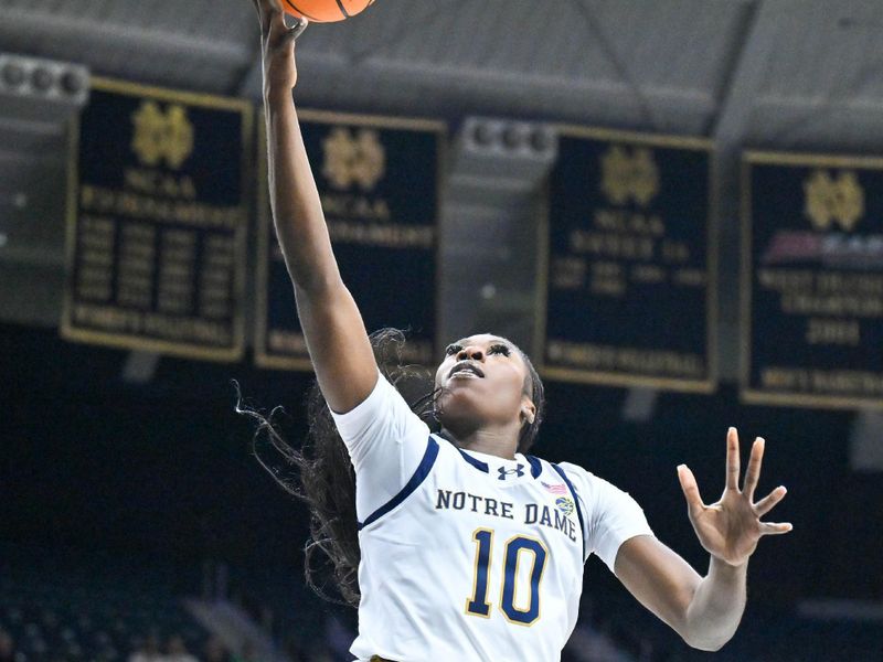 Jan 11, 2024; South Bend, Indiana, USA; Notre Dame Fighting Irish forward Becky Obinma (10) goes up for a shot in the second half against the Boston College Eagles at the Purcell Pavilion. Mandatory Credit: Matt Cashore-USA TODAY Sports