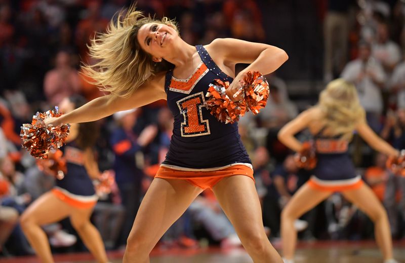 Feb 20, 2023; Champaign, Illinois, USA;  The Illinois fighting Illini cheer squad performs during the second half against the Minnesota Golden Gophers at State Farm Center. Mandatory Credit: Ron Johnson-USA TODAY Sports