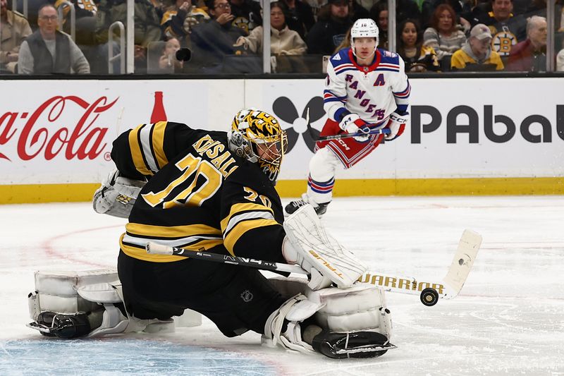 Nov 28, 2025; Boston, Massachusetts, USA; Boston Bruins goaltender Joonas Korpisalo (70) makes a pad save as New York Rangers left wing Artemi Panarin (10) looks for the rebound during the second period at TD Garden. Mandatory Credit: Winslow Townson-Imagn Images