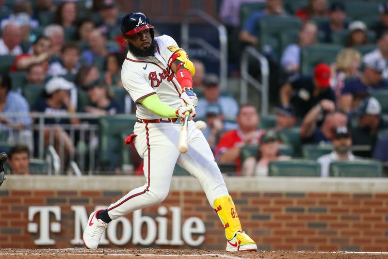 May 8, 2024; Atlanta, Georgia, USA; Atlanta Braves designated hitter Marcell Ozuna (20) hits a solo home run against the Boston Red Sox in the third inning at Truist Park. Mandatory Credit: Brett Davis-USA TODAY Sports
