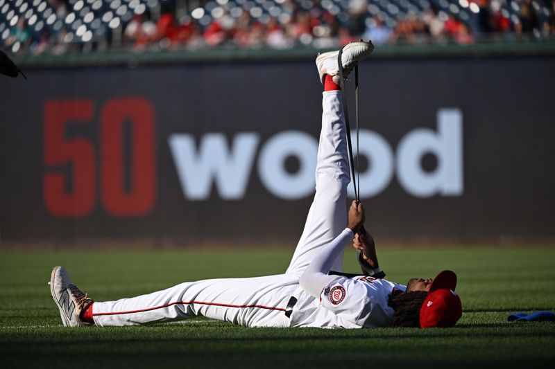 Jul 1, 2024; Washington, District of Columbia, USA; Washington Nationals center fielder James Wood (50) warms up in the outfield before his Major League Baseball debut against the New York Mets at Nationals Park. Mandatory Credit: Rafael Suanes-USA TODAY Sports
