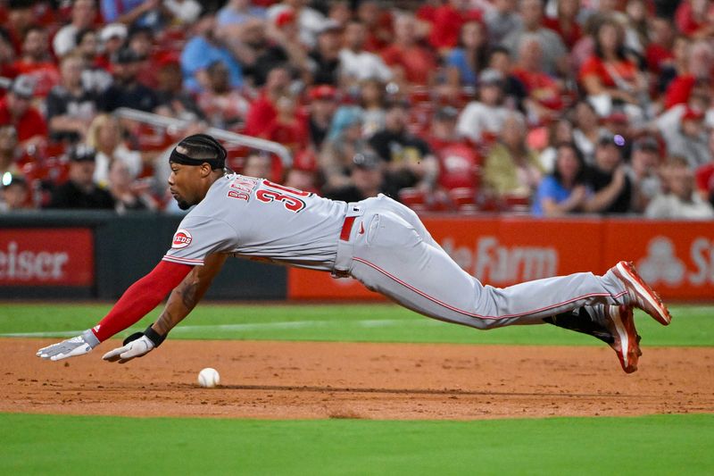 Sep 29, 2023; St. Louis, Missouri, USA;  Cincinnati Reds left fielder Will Benson (30) slides in at third for a one run triple against the St. Louis Cardinals during the second inning at Busch Stadium. Mandatory Credit: Jeff Curry-USA TODAY Sports