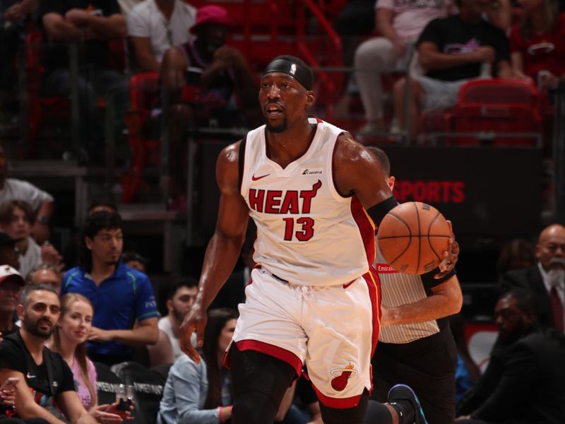 MIAMI, FL - MARCH 29: Bam Adebayo #13 of the Miami Heat dribbles the ball during the game against the Portland Trail Blazers on March 29, 2024 at Kaseya Center in Miami, Florida. NOTE TO USER: User expressly acknowledges and agrees that, by downloading and or using this Photograph, user is consenting to the terms and conditions of the Getty Images License Agreement. Mandatory Copyright Notice: Copyright 2024 NBAE (Photo by Issac Baldizon/NBAE via Getty Images)