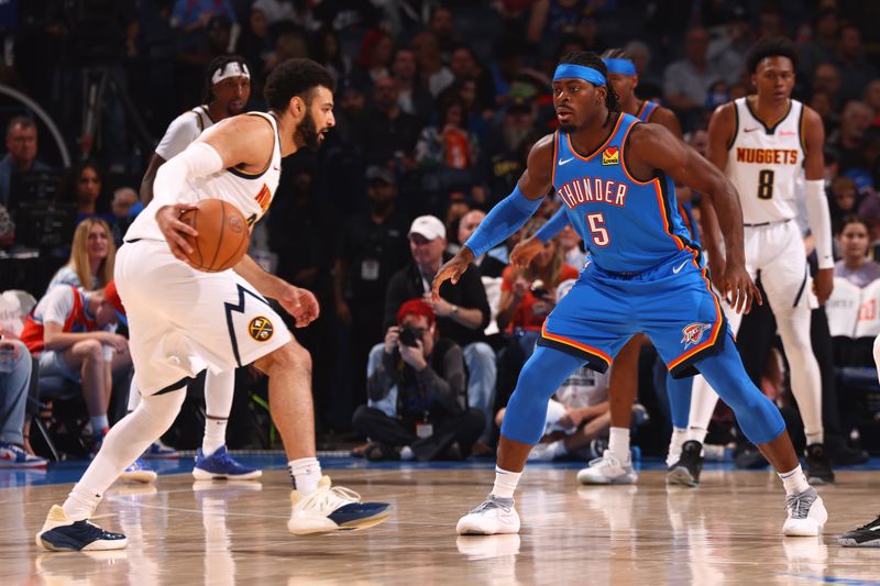 OKLAHOMA CITY, OK - JANUARY 31: Luguentz Dort #5 of the Oklahoma City Thunder plays defense during the game against the Denver Nuggets on January 31, 2024 at Paycom Arena in Oklahoma City, Oklahoma. NOTE TO USER: User expressly acknowledges and agrees that, by downloading and or using this photograph, User is consenting to the terms and conditions of the Getty Images License Agreement. Mandatory Copyright Notice: Copyright 2024 NBAE (Photo by Zach Beeker/NBAE via Getty Images)