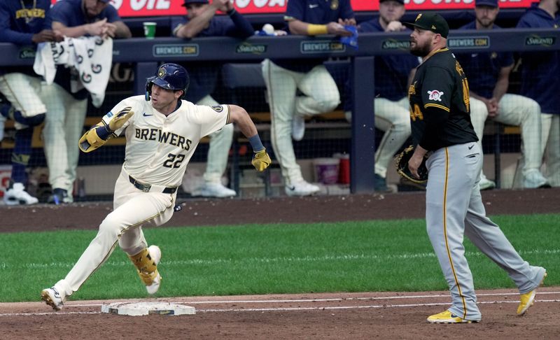 Jul 10, 2024; Milwaukee, Wisconsin, USA; Milwaukee Brewers outfielder Christian Yelich (22) rounds first base after hitting a single during the third inning against the Pittsburgh Pirates at American Family Field in Milwaukee, Wisconsin.  Mandatory Credit: Mark Hoffman-USA TODAY Sports