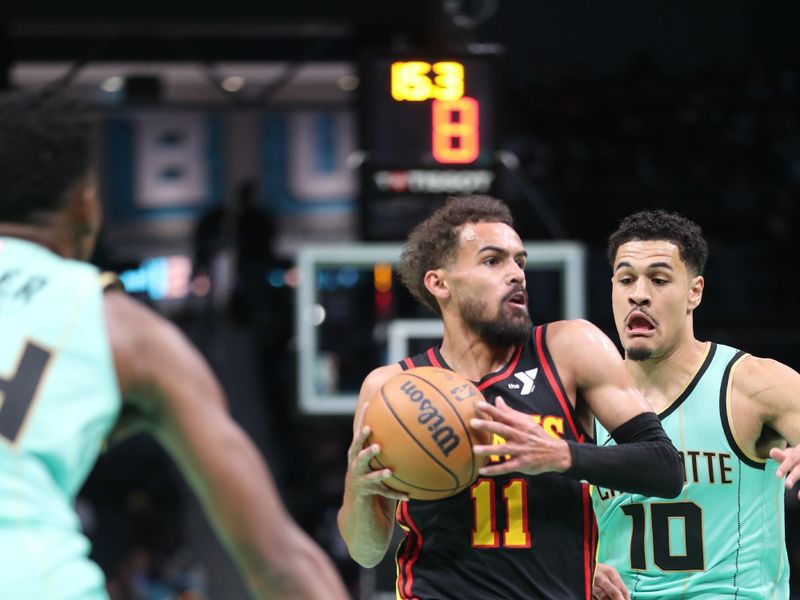 CHARLOTTE, NC - NOVEMBER 30: Trae Young #11 of the Atlanta Hawks drives to the basket during the game against the Charlotte Hornets on November 30, 2024 at Spectrum Center in Charlotte, North Carolina. NOTE TO USER: User expressly acknowledges and agrees that, by downloading and or using this photograph, User is consenting to the terms and conditions of the Getty Images License Agreement. Mandatory Copyright Notice: Copyright 2024 NBAE (Photo by Brock Williams-Smith/NBAE via Getty Images)