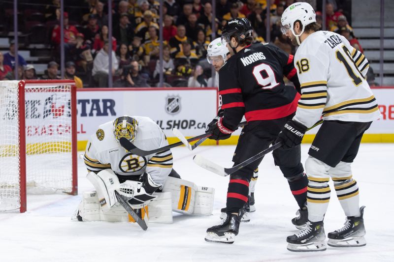 Jan 25, 2024; Ottawa, Ontario, CAN; Boston Bruins goalie Jeremy Swayman (1) makes a save in front of Ottawa Senators center Josh Norris (9) in the first period at the Canadian Tire Centre. Mandatory Credit: Marc DesRosiers-USA TODAY Sports