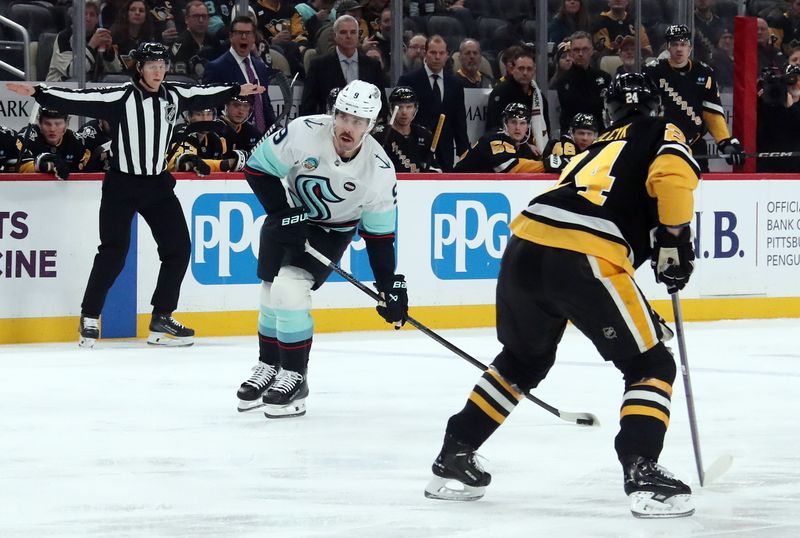 Jan 14, 2025; Pittsburgh, Pennsylvania, USA;  Seattle Kraken center Chandler Stephenson (9) shoots and scores a short-handed goal against the Pittsburgh Penguins during the first period at PPG Paints Arena. Mandatory Credit: Charles LeClaire-Imagn Images