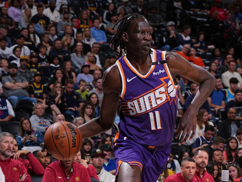 DENVER, CO - OCTOBER 13: Bol Bol #11 of the Phoenix Suns drives to the basket during the game against the Denver Nuggets on October 13, 2024 at Ball Arena in Denver, Colorado. NOTE TO USER: User expressly acknowledges and agrees that, by downloading and/or using this Photograph, user is consenting to the terms and conditions of the Getty Images License Agreement. Mandatory Copyright Notice: Copyright 2024 NBAE (Photo by Garrett Ellwood/NBAE via Getty Images)