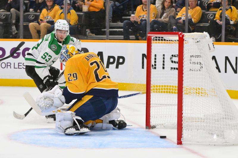 Oct 26, 2025; Nashville, Tennessee, USA;  Dallas Stars center Wyatt Johnston (53) scores past Nashville Predators goaltender Justus Annunen (29) during the second period at Bridgestone Arena. Mandatory Credit: Steve Roberts-Imagn Images