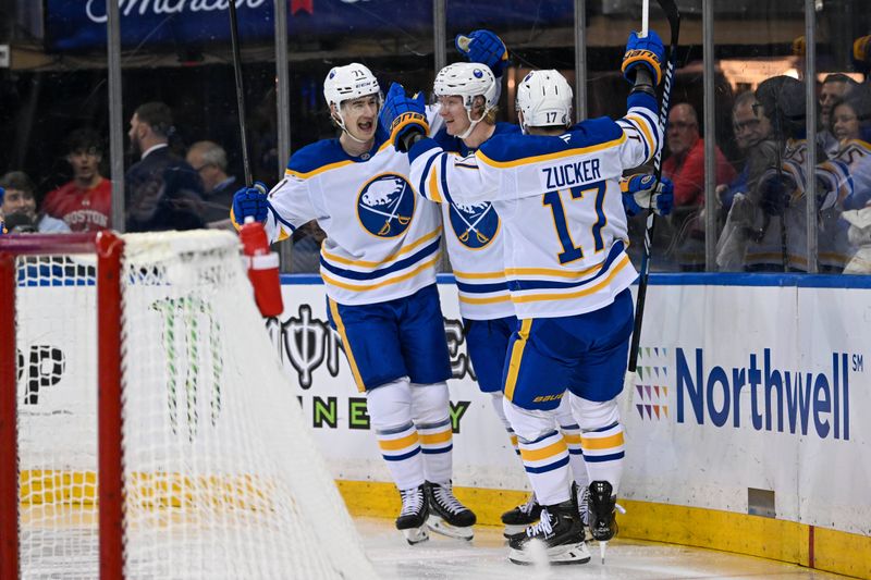 Nov 7, 2024; New York, New York, USA;  Buffalo Sabres center Ryan McLeod (71) and left wing Jason Zucker (17) celebrate the goal by defenseman Rasmus Dahlin (26) against the New York Rangers during the first period at Madison Square Garden. Mandatory Credit: Dennis Schneidler-Imagn Images