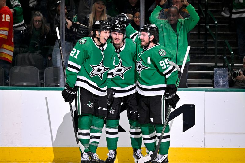 Mar 6, 2025; Dallas, Texas, USA; Dallas Stars left wing Jason Robertson (21) and center Matt Duchene (95) and center Roope Hintz (24) celebrates after Robertson scores the game winning goal the Calgary Flames during the overtime period at the American Airlines Center. Mandatory Credit: Jerome Miron-Imagn Images