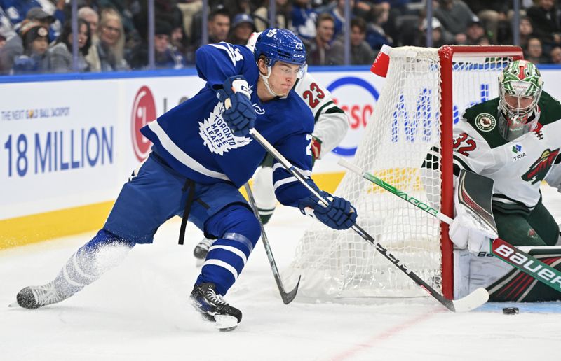 Oct 14, 2023; Toronto, Ontario, CAN;   Toronto Maple Leafs forward Matthew Knies (23) is stopped by Minnesota Wild goalie Filip Gustavsson (32) in the first period at Scotiabank Arena. Mandatory Credit: Dan Hamilton-USA TODAY Sports