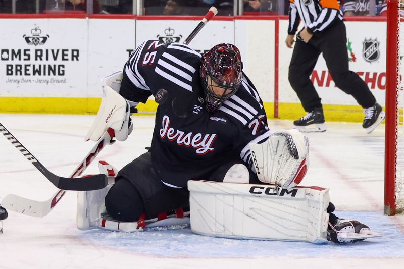 Nov 27, 2024; Newark, New Jersey, USA; New Jersey Devils goaltender Jacob Markstrom (25) makes a save against the St. Louis Blues during the third period at Prudential Center. Mandatory Credit: Ed Mulholland-Imagn Images