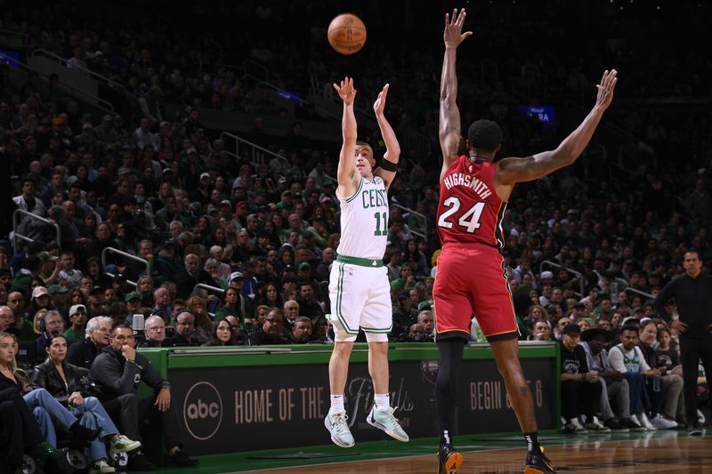 BOSTON, MA - APRIL 21: Payton Pritchard #11 of the Boston Celtics shoots a three point basket against the Miami Heat during Round 1 Game 1 of the 2024 NBA Playoffs on April 21, 2024 at the TD Garden in Boston, Massachusetts. NOTE TO USER: User expressly acknowledges and agrees that, by downloading and or using this photograph, User is consenting to the terms and conditions of the Getty Images License Agreement. Mandatory Copyright Notice: Copyright 2024 NBAE  (Photo by Brian Babineau/NBAE via Getty Images)